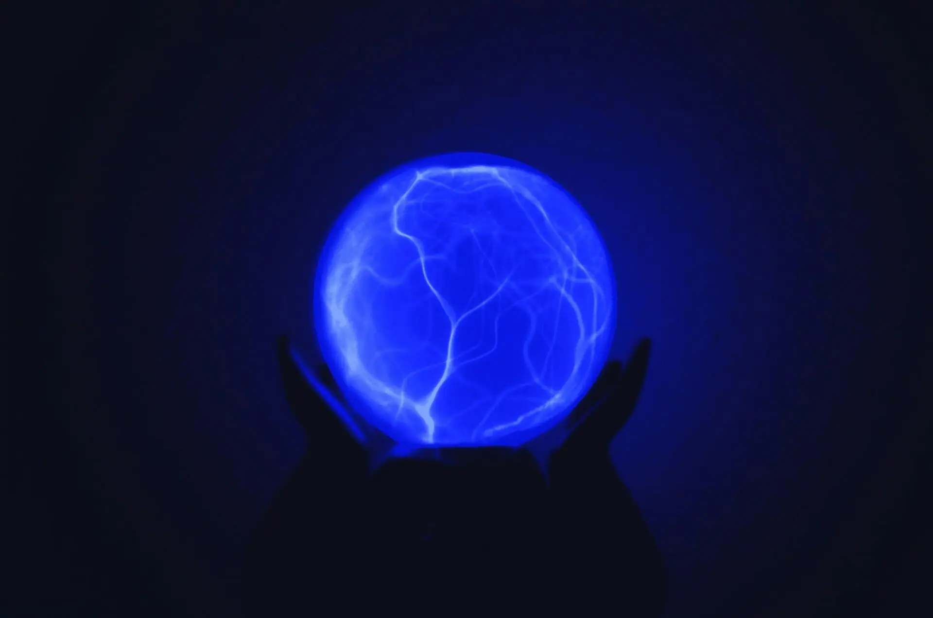 Embarking on the Buddha Circuit: A Spiritual Pilgrimage through India 2 low light photo of person holding blue lighted ball